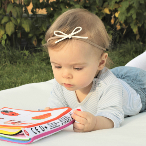 Baby girl with book